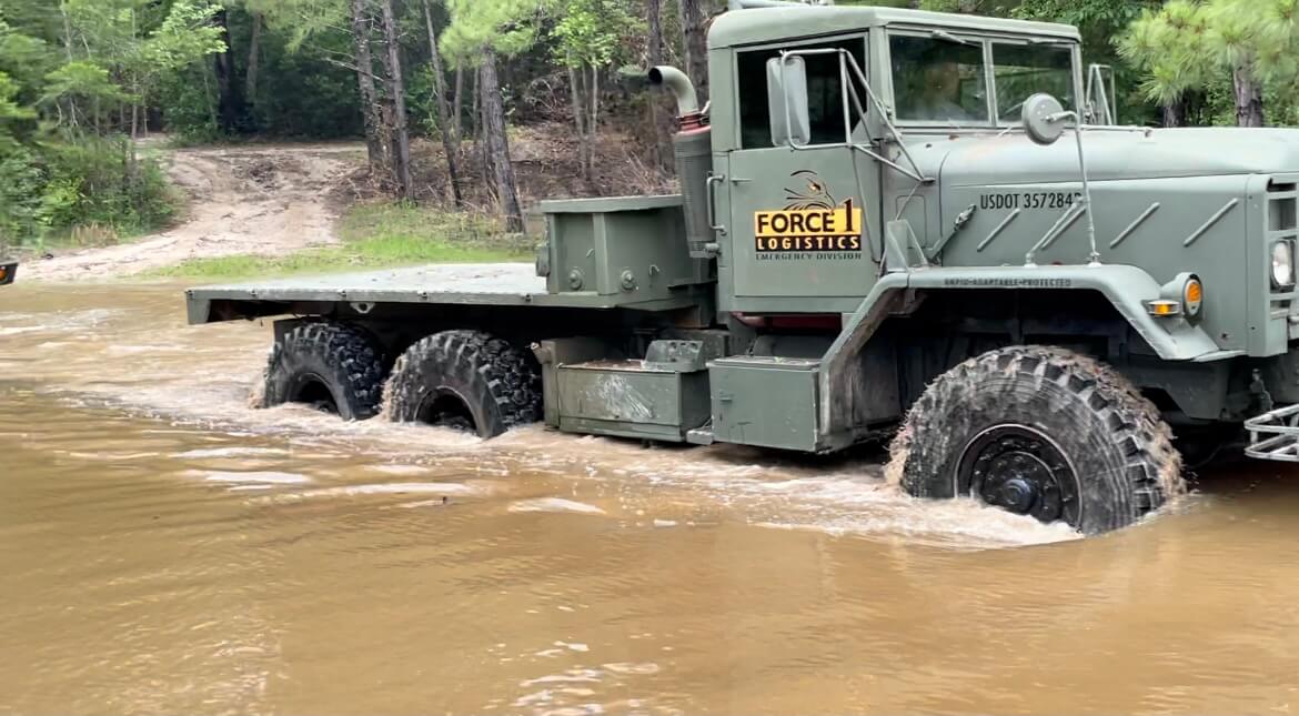Force 1 Logistics truck pushing through deep flood water